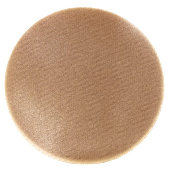 Here's an alt tag for the image: Round beige makeup sponge.